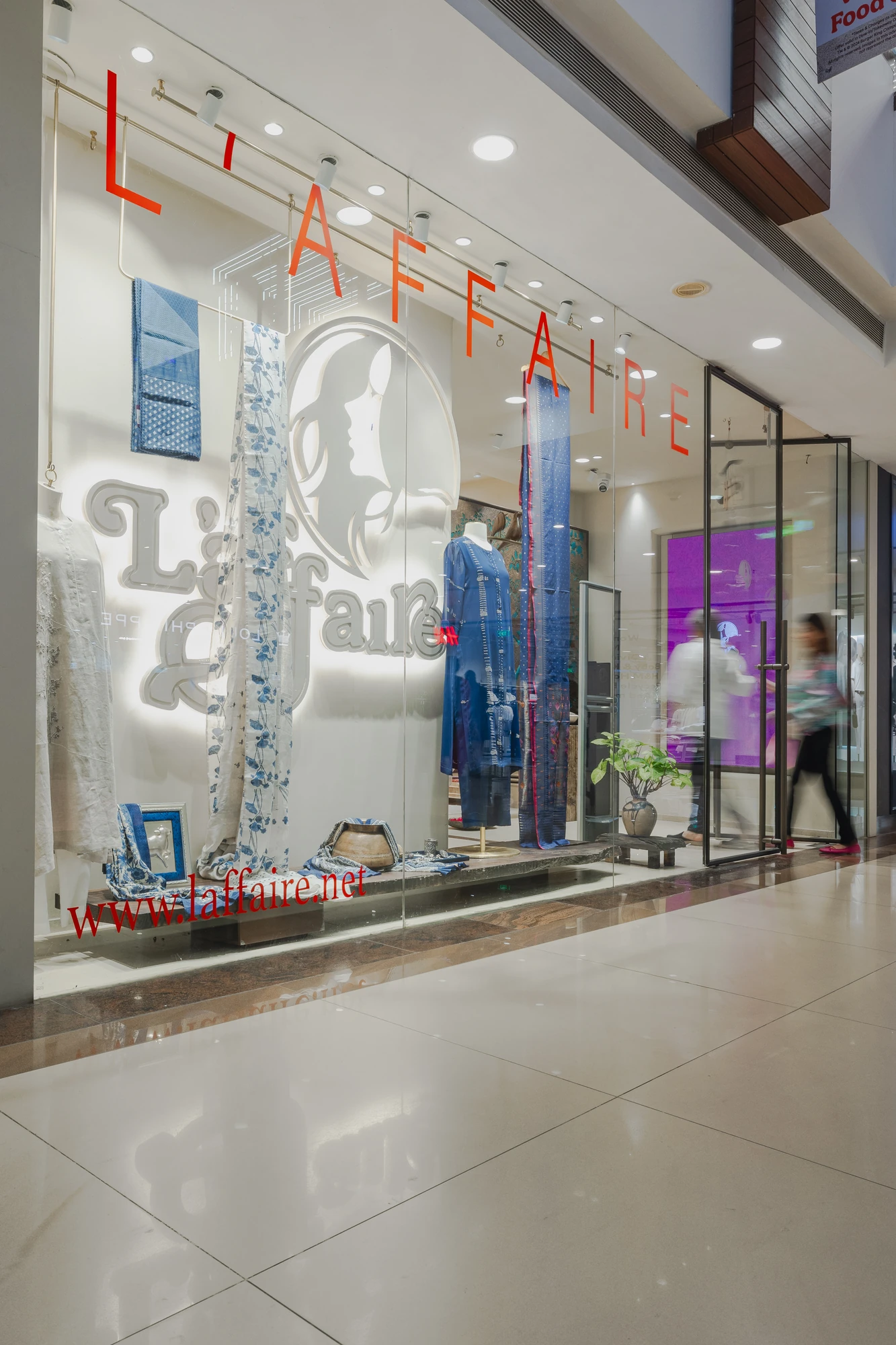 The L’affaire shopfront at Select Citywalk: the L’affaire name and logo on the glass