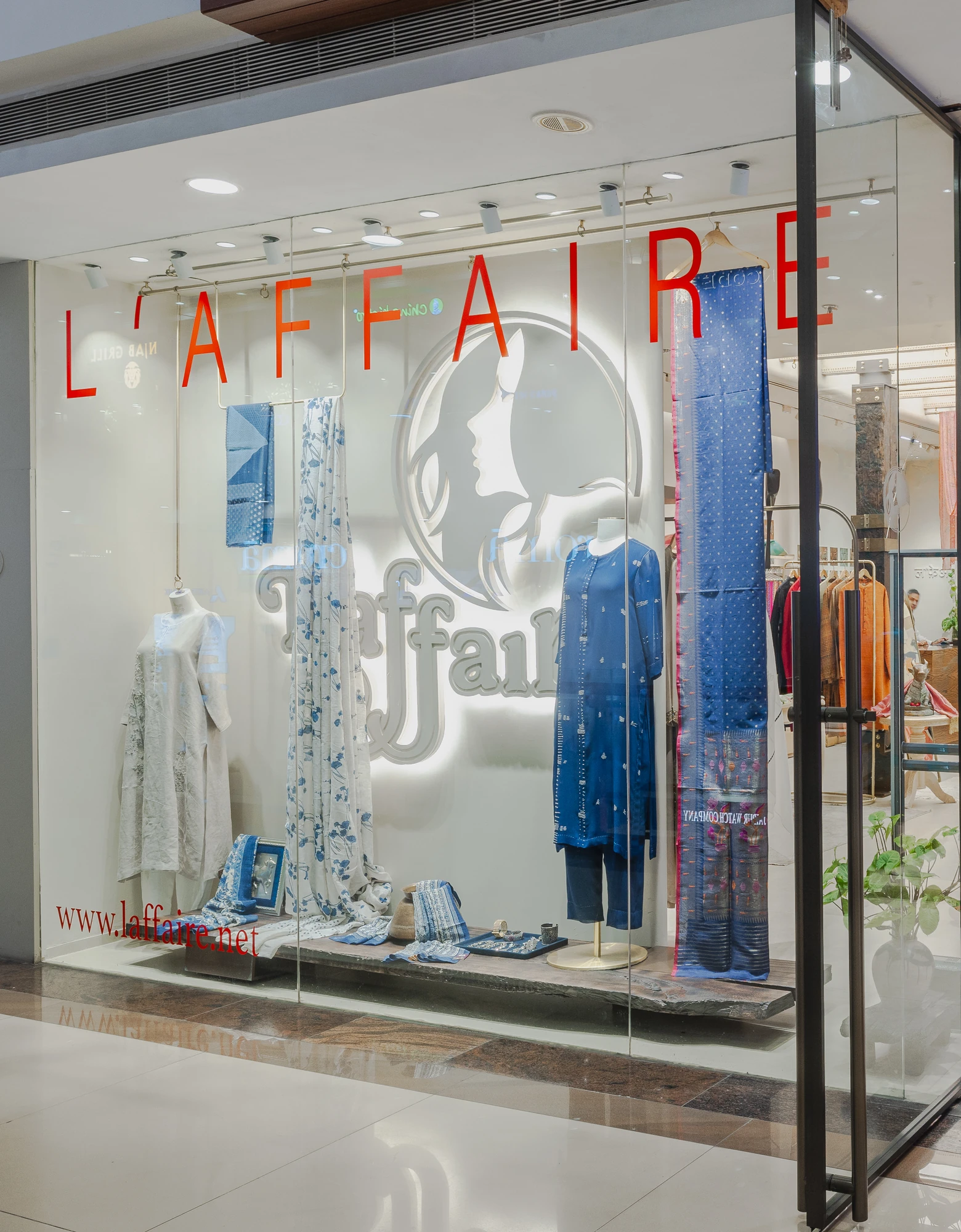 The L’affaire shopfront at Select Citywalk: the L’affaire name and logo on the glass